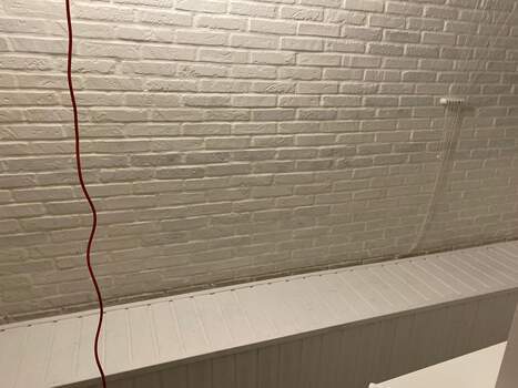 Отделка камнем с утеплением балкона Сапожок